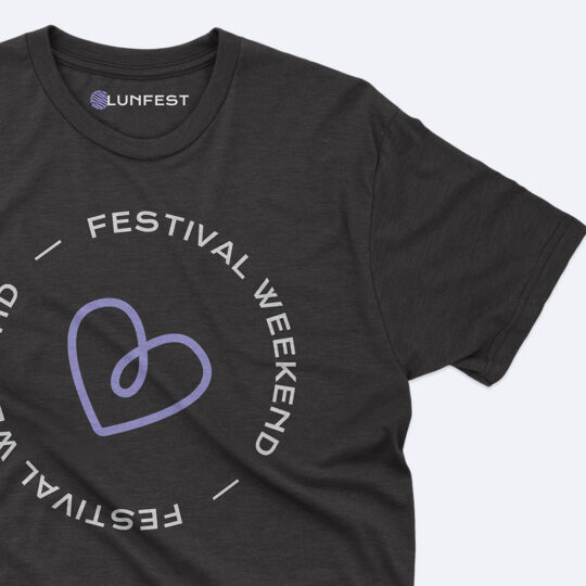 A black t-shirt with a heart and the words festival weekend.