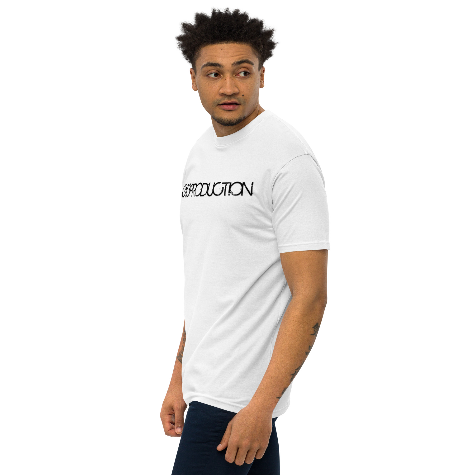 A man wearing a white t-shirt with the word religion on it.